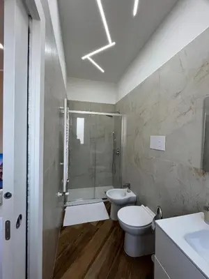 a bathroom with a shower and a toilet and a sink at Casa Miriam 281 in Palermo
