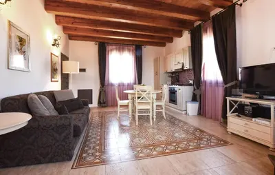 a living room with a couch and a table at 1 Bedroom Stunning Home In Partinico in Partinico