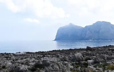 a large body of water with mountains in the background at Gorgeous Apartment In Capaci With Wifi in Capaci