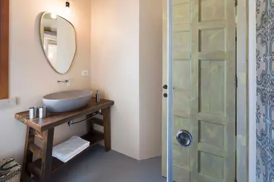 a bathroom with a sink and a mirror at Villa Zingaro Cala Bianca in Castellammare del Golfo