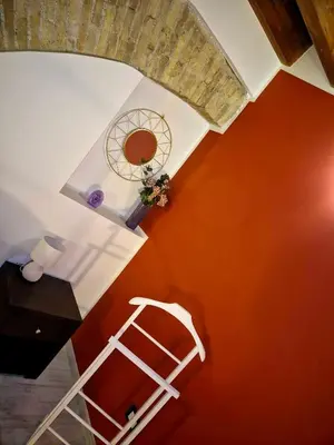 an overhead view of a room with a bed and a ladder at Patania Royal Apartment in Palermo