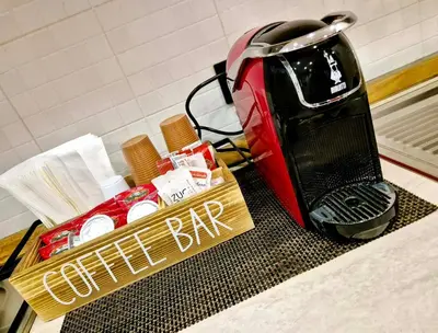 a toaster sitting on top of a counter with a sign at Patania Royal Apartment in Palermo