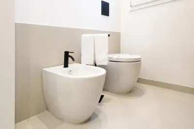 a bathroom with a sink and a toilet at Merlo5 in Palermo