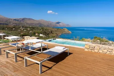a villa with a pool and a view of the ocean at Villa Scopello Cala Bianca in Castellammare del Golfo