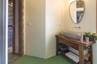a bathroom with a sink and a mirror at Villa Scopello Cala Bianca in Castellammare del Golfo