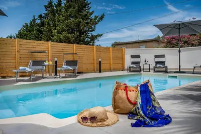a large swimming pool with a hat at Trinacrys - Casa Vacanze in Alcamo