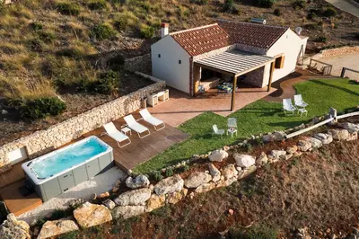 an aerial view of a house with a swimming pool at Villa Ancora Cala Bianca in Castellammare del Golfo