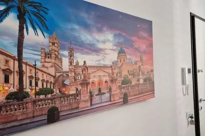 a painting of a large building on a wall at Casa Maielli in Palermo