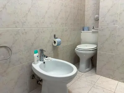 a bathroom with a toilet and a sink at La Casetta di Ale - By Rental BeB Italy - in Palermo