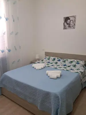 a bedroom with a bed with towels on it at Casa Agatea in Balestrate