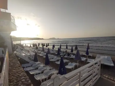 a group of chairs and umbrellas on the beach at Villino Giovanna a Trabia a 200 mt dal mare in Trabia