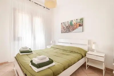 a bedroom with a large bed with towels on it at Villa Capreria by Sicily Travelling Villas in Scopello