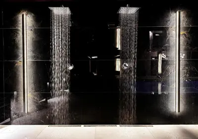 a glass door with water coming out of it at Alba Gold LUXURY SUITE & VILLA in Cefalù