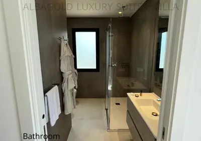 a bathroom with a glass shower and a sink at Alba Gold LUXURY SUITE & VILLA in Cefalù
