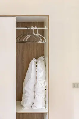 a closet with a pillow and a hanger at Villa Berretta by Sicily Travelling Villas in Scopello