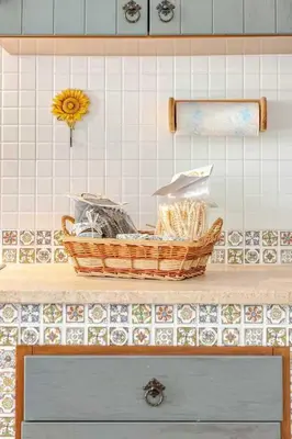 a counter with baskets on top of a kitchen counter at Villa Uzzo by Sicily Travelling Villas in Scopello