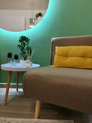 a living room with a couch and a table at A me casa in Palermo
