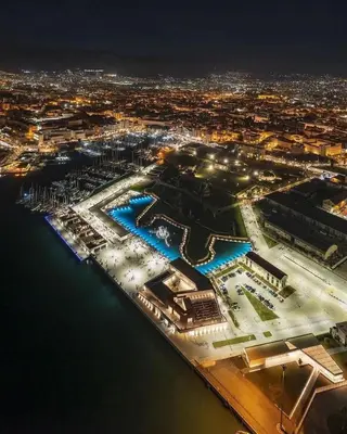 an aerial view of a harbor at night at A me casa in Palermo