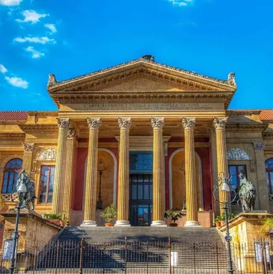 a large building with columns on the front of it at A me casa in Palermo