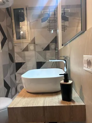 a bathroom with a white sink and a toilet at A me casa in Palermo