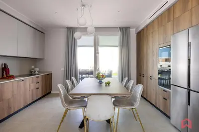 a dining room with a table and chairs in a kitchen at Brand New Villa with Private Heated Pool in Terrasini