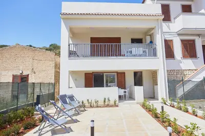 a villa with a view of the courtyard of a house at Le Residenze di Zio Toto' in Scopello
