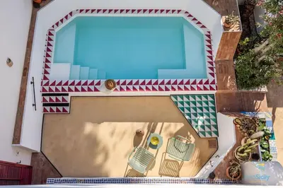 a model of a swimming pool with a table and chairs at Verosicily Villa Damus in Terrasini