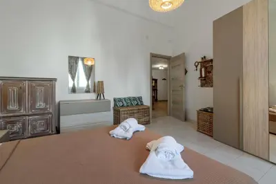 a bathroom with two towels sitting on the floor at GuestHost - The Flavour of Palermo - Kalsa Lovely Apartment in Palermo
