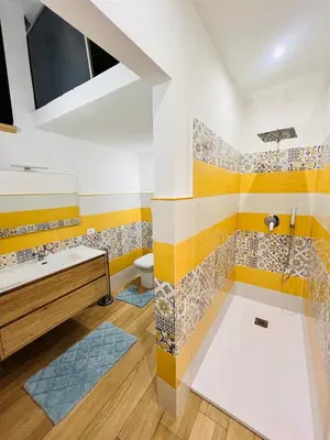 a bathroom with a tub and a sink at Casa Vacanze di Maria in Palermo