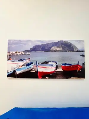 a group of boats are lined up on the water at Casa Vacanze di Maria in Palermo
