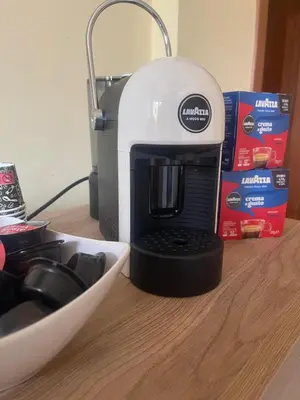 a coffee maker sitting on top of a table at Sicily Holiday Home in Termini Imerese