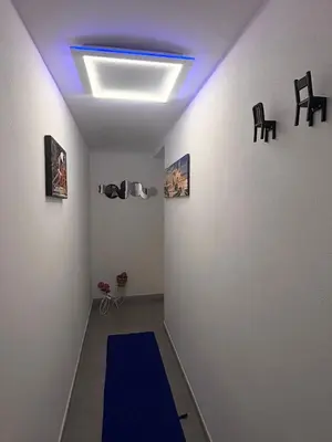 a room with a blue ceiling with a blue carpet at Palermo Holiday Room in Palermo