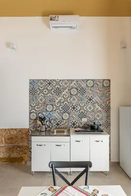 a kitchen with a sink and a stove at Casa Lolli by Wonderful Italy in Palermo