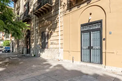 a building with a door on the side of a street at Casa Lolli by Wonderful Italy in Palermo