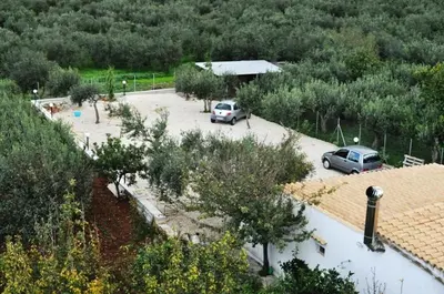 two cars are parked in a parking lot at Dolce Siesta in Castelluzzo