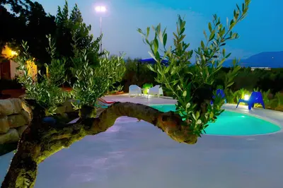 a resort with a swimming pool at night at Villa Due Pini con piscina privata in Alcamo