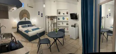 a bedroom with a bed and a table and chairs at bonito apartment2 in Palermo