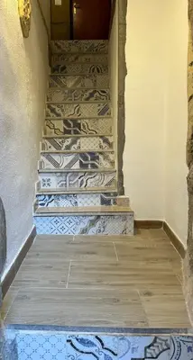 a set of stairs in a hallway with a door at bonito apartment2 in Palermo
