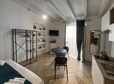 a kitchen with a table and chairs in a room at bonito apartment2 in Palermo