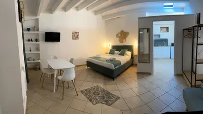 a bedroom with a bed and a table in a room at bonito apartment in Palermo