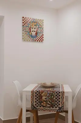 a white table with a table cloth on it at Dimora del Moro in Palermo