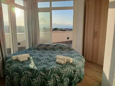 a bedroom with a bed with two pillows on it at HolidayHouse Belvedere in Terrasini