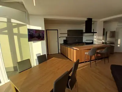 a kitchen and dining room with a table and chairs at HolidayHouse Belvedere in Terrasini
