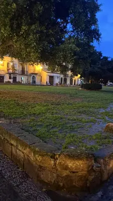 a stone walkway in front of a house at night at Alloro Apartment 9 in Palermo