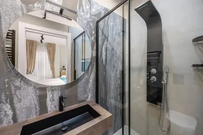 a bathroom with a sink and a mirror at D'ossuna66 Aquarium in Palermo