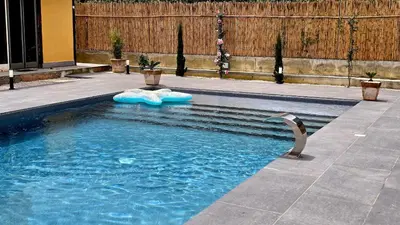 a bird standing in a pool of water at Villa Orlando in Trabia