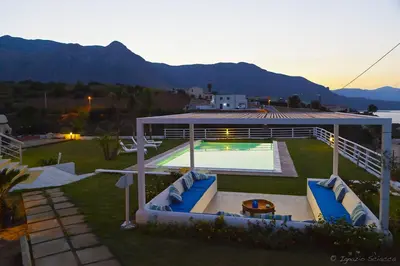 a backyard with a swimming pool and a pavilion at Casa Azul in Castellammare del Golfo