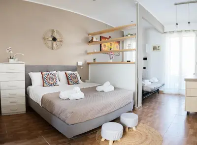 a bedroom with a bed with two towels on it at Locazione Turistica Aurora in Palermo