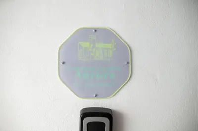 a stop sign on a wall with a cell phone at Locazione Turistica Aurora in Palermo