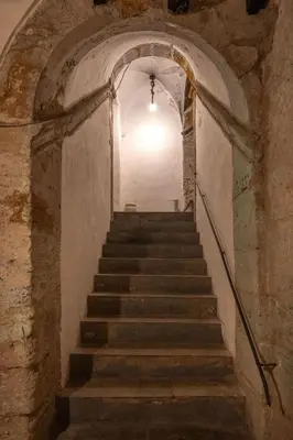 a stairway in an old building with a bunch of stairs at Dimore D'amare in Palermo